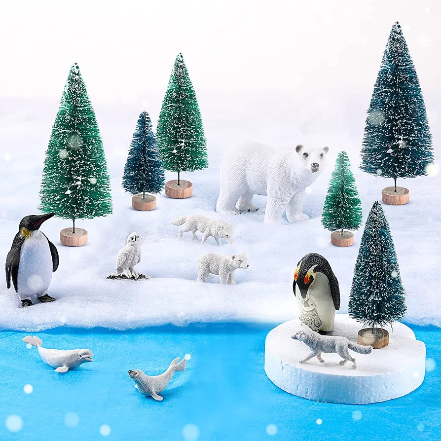 19 Pcs Polar Animals Figurines Arctic Animal Toy Set includes 10 Polar Animals Figurines 6 Miniature Pine Trees 1 Foam Boards 1 Winter Fake Snow Blanket 2 Blue Tissue Paper for Kids